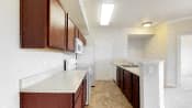a kitchen with a white counter top and