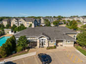 an aerial view of a large house with a swimming pool