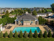 an aerial view of a house with a swimming pool