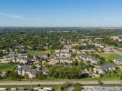 an aerial view of a city with houses and trees