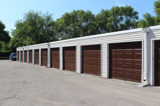 a row of garage doors in a parking lot