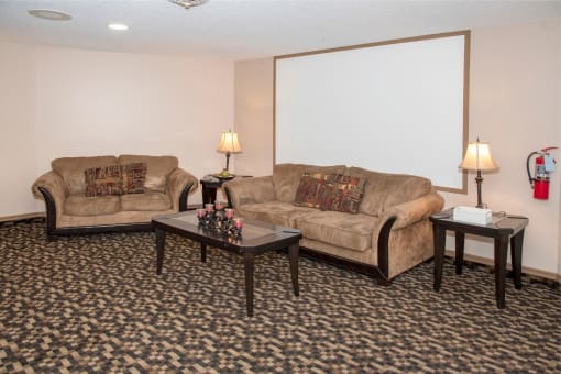 a living room with couches and tables
