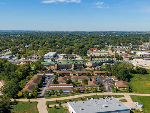 an aerial view of a neighborhood with houses and trees