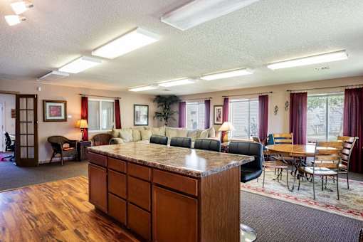 a living room with a couch and a counter in the middle