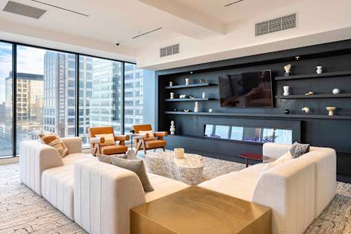 a living room filled with furniture and a large window at 220 Meridian, Indianapolis, IN 46204