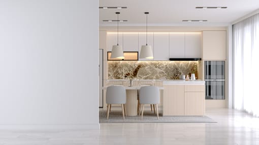 A modern kitchen with a dining table and chairs.