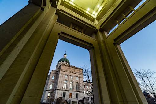 A view of a building through a framed opening.