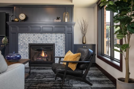 View of cozy clubhouse with fire place and seating area at The Whitley in St. Paul, MN.