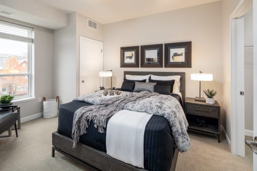 a bedroom with a large bed at The Gallery Apartments, Burnsville