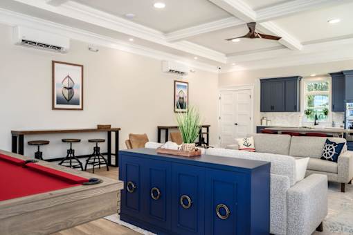 A room with a pool table and a blue cabinet at The Promenade at Easton Apartments, Easton, MD