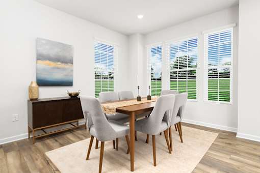 A dining room with a wooden table and chairs. at Forge Overlook, Halethorpe