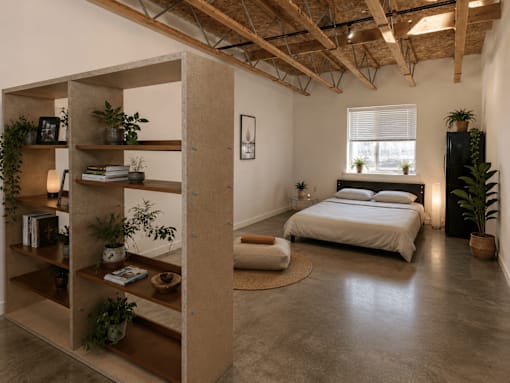 A bedroom with a bed, a shelf, and a rug.
