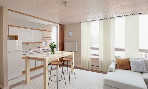 A modern kitchen with a dining table and chairs.