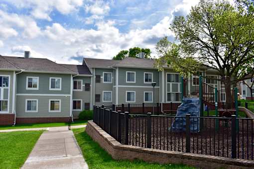 A residential area with houses and a playground.