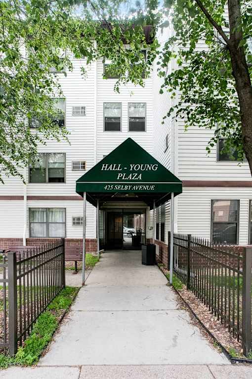 The entrance to a residential building named Hall Young Plaza.