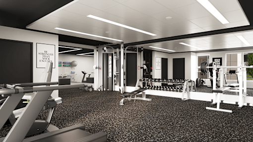 A gym with a variety of equipment including a squat rack, bench press, and a rowing machine.