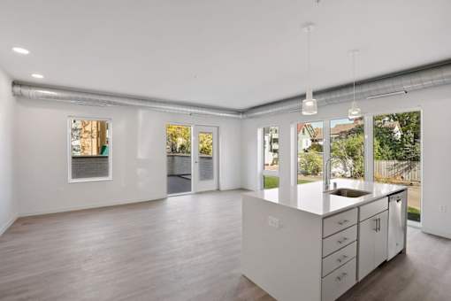 A modern kitchen with a sink and cabinets.