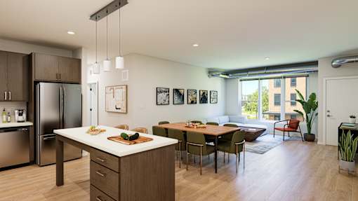 A modern kitchen with a dining table and chairs.
