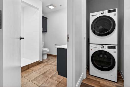 A white washer and dryer in a laundry room.