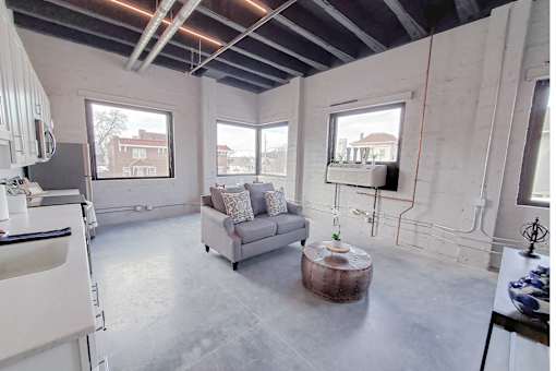 A living room with a couch and a coffee table.