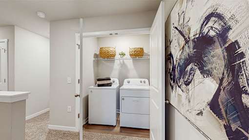 A laundry room with a washer and dryer in it.