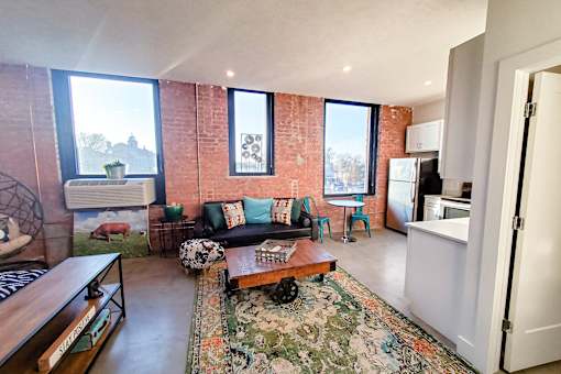 A living room with a couch and a coffee table.