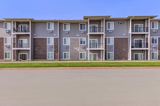 Apartment building with the number 2710 on the front.
