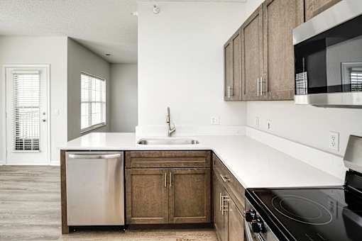 A kitchen with a black stove top oven.