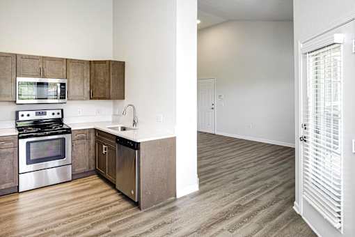 A kitchen with a stove top oven and microwave.