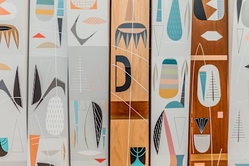A series of abstract art pieces with geometric shapes and lines.