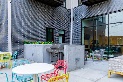A patio with a table and chairs.