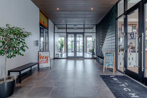 A hallway with a sign that says "hey flow" on it.