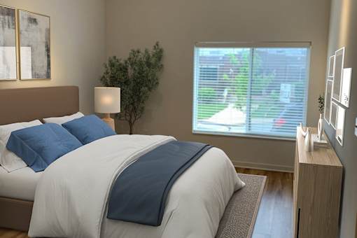 A bedroom with a bed, nightstand, and window.