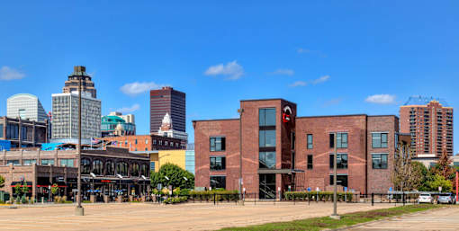 A cityscape with a mix of modern and older buildings.