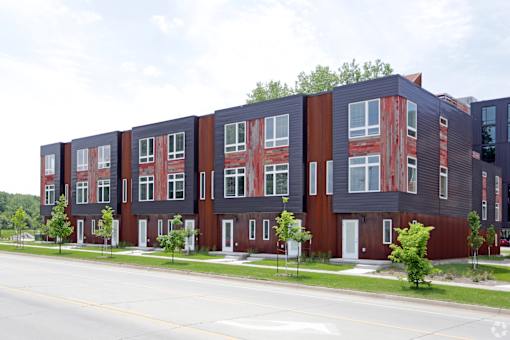 A long building with red and black exterior.