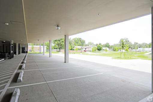 A parking lot with a concrete floor and a white ceiling.