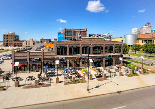 Full view of building with resturants attached.