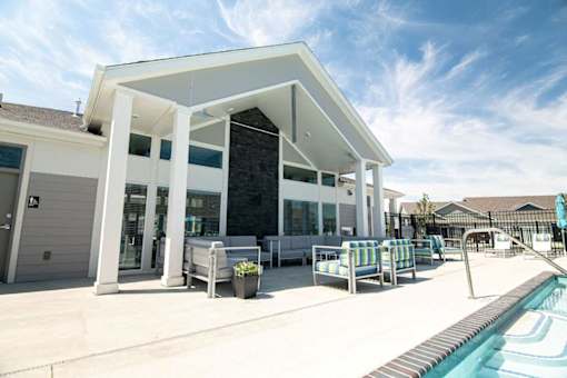 A modern house with a pool in the backyard.