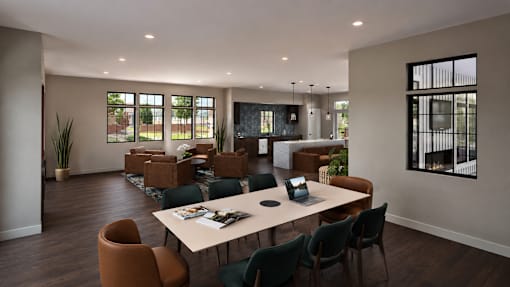 A conference room with a long table surrounded by chairs.