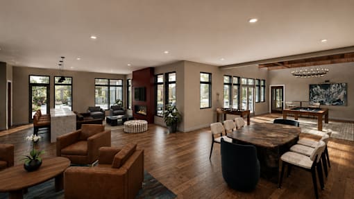 A modern living room with a large wooden table and chairs.