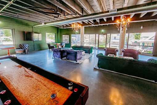A billiard table is in the foreground of this image.