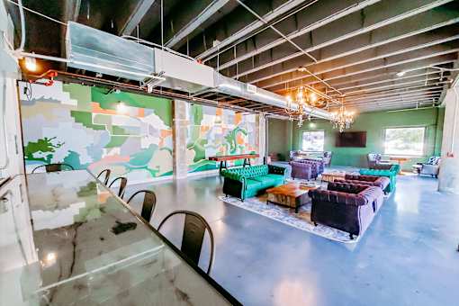 A room with a glass table and a wall with a map on it.