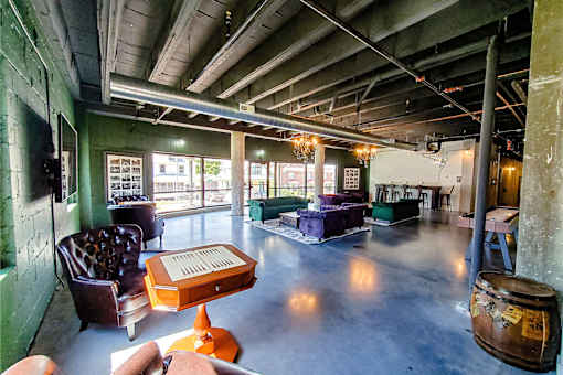 A room with a green wall and a wooden table.