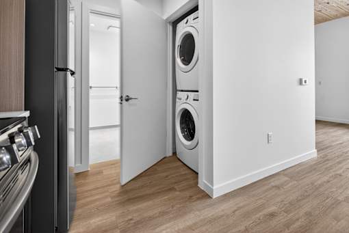A modern laundry room with a washer and dryer.