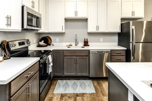 Two tone shaker cabinets with large kitchens at Echo Park in Omaha, NE