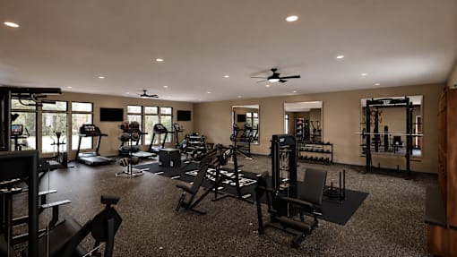 A spacious gym with a variety of equipment.