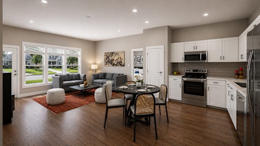 A modern kitchen with a dining table set for four.