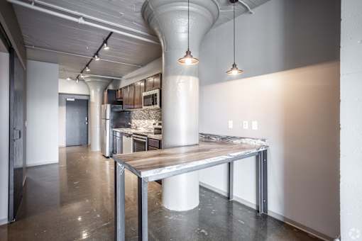 A modern kitchen with a large island in the middle.