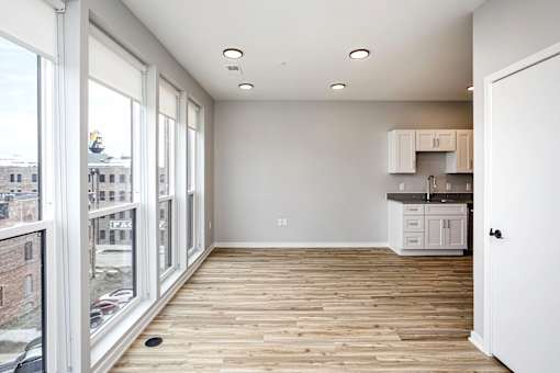 A room with a wooden floor and white walls.