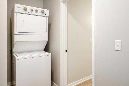 A white oven and dishwasher in a room.